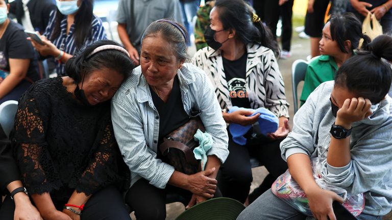 Relatives of victims mourn at Sri Uthai temple in Na Klang district, following a mass shooting in the town of Uthai Sawan in the province of Nong Bua Lam Phu, Thailand October 7, 2022. REUTERS/Athit Perawongmetha