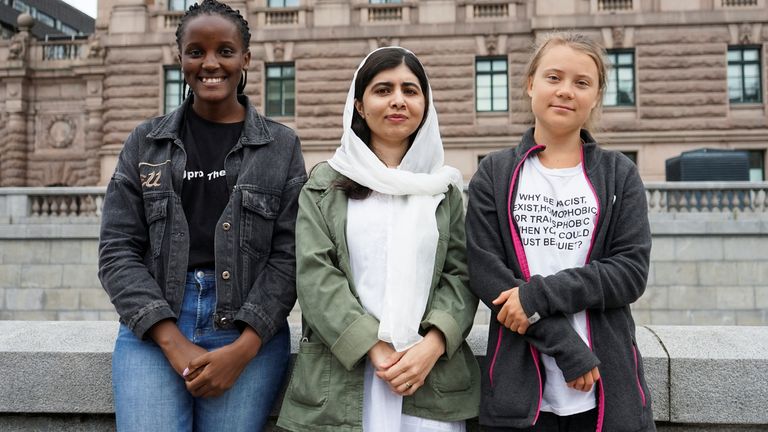 Nakate (left) with Malala Yousafzai and Greta Thunberg in Stockholm in June