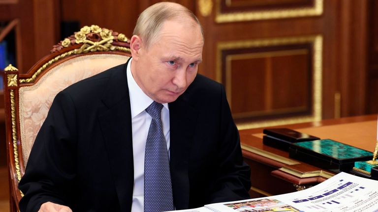 Russian President Vladimir Putin listens to Samara Region Governor Dmitry Azarov during their meeting in Moscow, Russia, Tuesday, Oct. 18, 2022. (Gavriil Grigorov, Sputnik, Kremlin Pool Photo via AP)