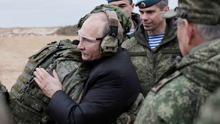 Russian President Vladimir Putin hugs a serviceman at a training centre of the Western Military District for mobilised reservists, in Ryazan Region, Russia October 20, 2022. Russian Defence Ministry/Handout via REUTERS ATTENTION EDITORS - THIS IMAGE WAS PROVIDED BY A THIRD PARTY. NO RESALES. NO ARCHIVES. MANDATORY CREDIT.