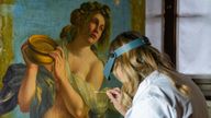 Restorer Elizabeth Wicks works on the Allegory Of Inclination. Pic: AP