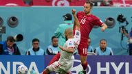 Christian Eriksen is tackled by Tunisia&#39;s Aissa Laidouni. Pic: AP