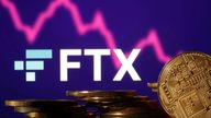 FILE PHOTO: Representations of cryptocurrencies are seen in front of displayed FTX logo and decreasing stock graph in this illustration taken November 10, 2022. REUTERS/Dado Ruvic/Illustration/File Photo