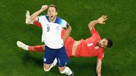 Kane went down after a sliding tackle from Iran&#39;s Morteza Pouraliganji. Pic: AP