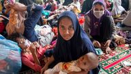 Ethnic Rohingya refugees sit at a temporary shelter in North Aceh, Indonesia, Tuesday, Nov. 15, 2022. More than 100 Rohingya Muslims traveling in a boat were found along the coast of Indonesia...s Aceh province on Tuesday. (AP Photo/Zik Maulana)