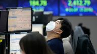 A trader is seen in the dealing room of the KEB Hana Bank headquarters in Seoul, South Korea. Pic: AP