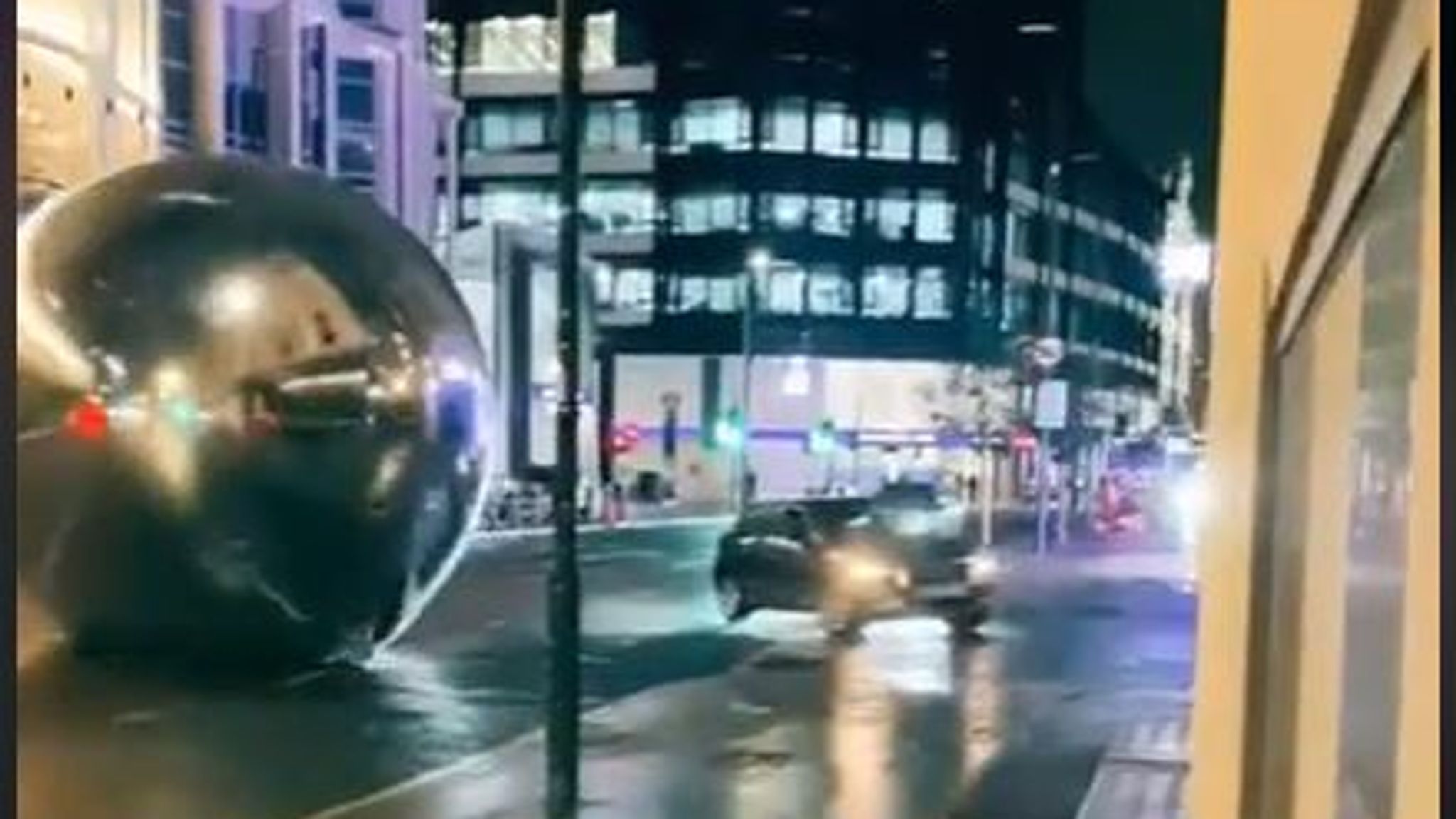 Giant orbs blown down by Storm Claudio bounce along London street | UK News | Sky News