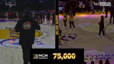 Fan wins $75,000 by making half-court shot!