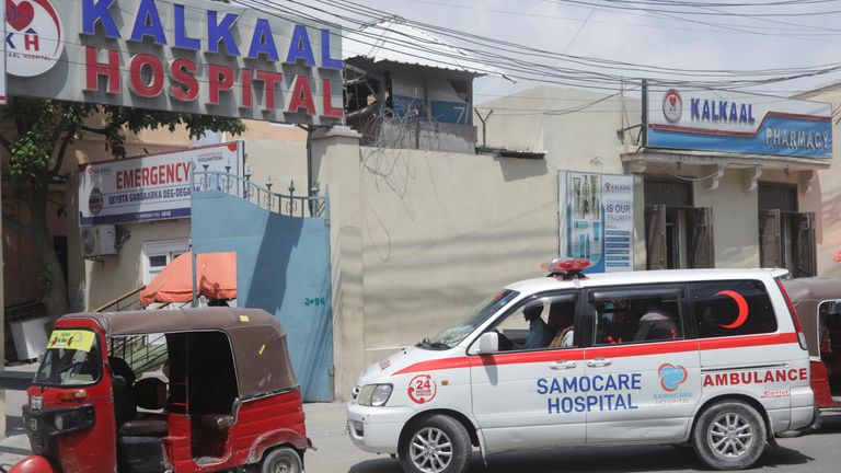 An ambulance takes an injured person to hospital after the al Shabaab attack in Mogadishu