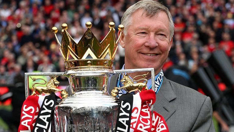 Sir Alex Ferguson lifts the Barclays Premier League trophy