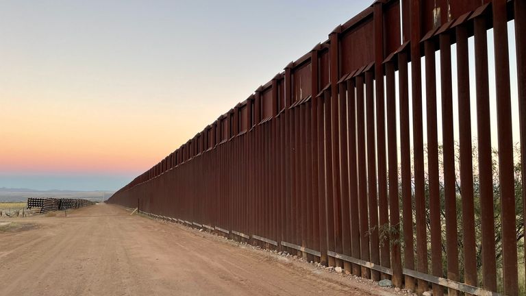 The border in Cochise County, where Mexico meets Arizona. James Matthews piece with Mark Dannels, Sheriff 