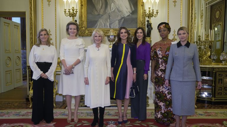 (L-R) The Countess of Wessex, Queen Mathilde of Belgium, Camilla, the Queen Consort, Queen Rania of Jordan, Danish Crown Princess Mary, the first lady of Sierra Leone Fatima Maada Bio, and the first lady of Ukraine Olena Zelenska.