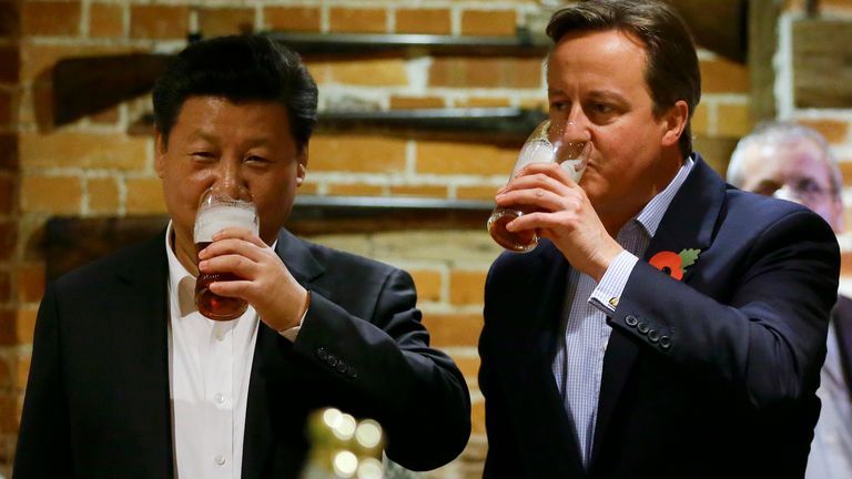 Prime Minister David Cameron drinks a pint with Chinese President Xi Jinping at The Plough Inn at Cadsden in Princes Risborough