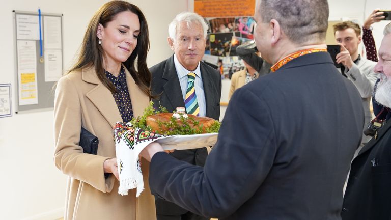 The Princess of Wales looked on admiringly at a special food presentation by members of the community centre