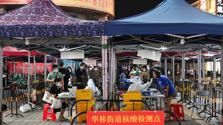 People line up to take COVID tests in Guangzhou, Guangdong Province, China.  Photo: cnsphoto via Reuters