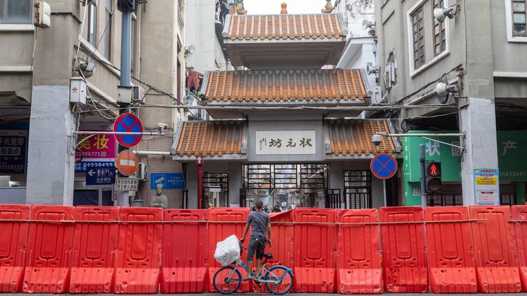 A temporary wall enclosing a shopping area considered high risk for COVID infections in Guangzhou, Guangdong province, China. Pic: AP