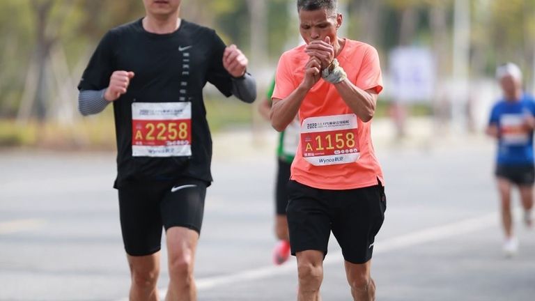 Chen is seen taking a puff as he looked to pass a rival runner