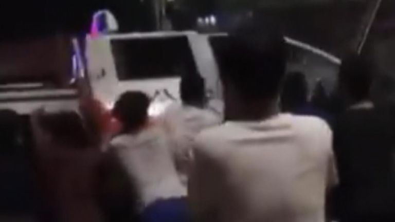 Protesters topple a vehicle in China, angry at COVID restrictions