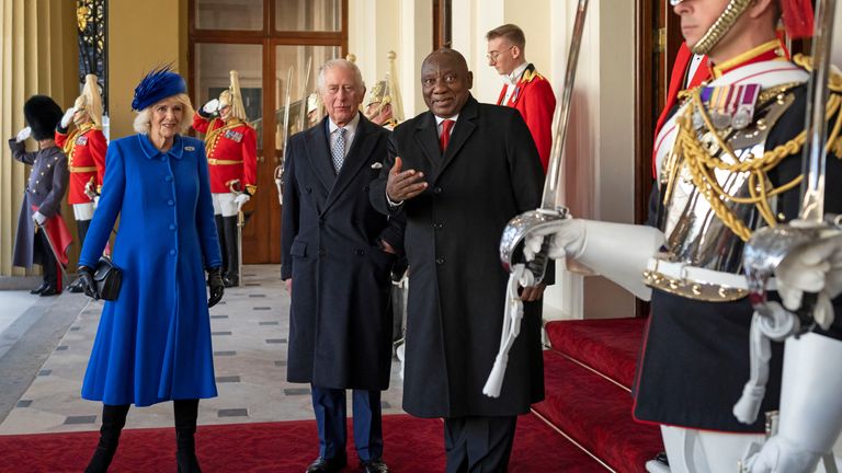 President of South Africa Cyril Ramaphosa, reacts as he stands with King Charles III and Camilla, the Queen Consort, at Buckingham Palace 
