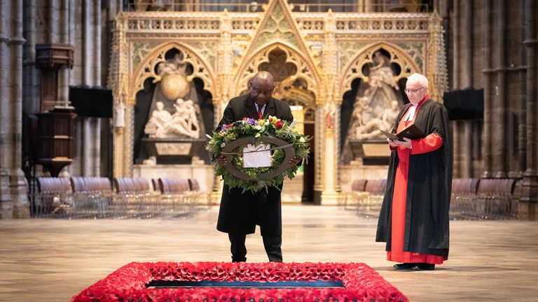 President Cyril Ramaphosa of South Africa, accompanied by the Dean of Westminster Abbey, The Reverend David Hoyle, lays a wreath at the Tomb of the Unknown Warrior during a tour of Westminster Abbey  