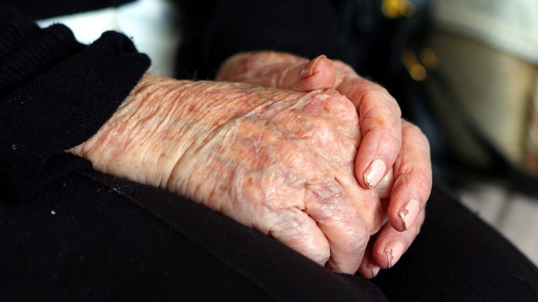 Hands of an elderly woman at home