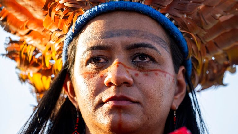 15 November 2022, Egypt, Scharm El Scheich: An Indigenous woman stands during a demonstration at the UN Climate Summit COP27. Photo by: Christophe Gateau/picture-alliance/dpa/AP Images