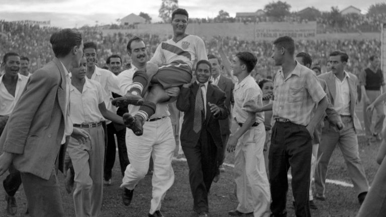 U.S. center forward Joe Gaetjens is carried off by cheering fans after his team beat England 1-0 in the World Cup qualifier match at Belohorizonte, Brazil, June 28, 1950. Gaetjens scored the winning goal in the shock result of the tournament. (AP Photo)