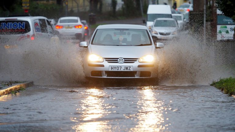 Drivers struggle through a flooded road in Barnham, West Sussex, following heavy rainfall overnight. Picture date: Thursday November 3, 2022.
