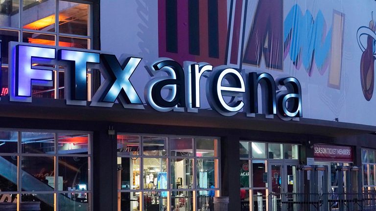 FILE - A sign for FTX Arena, where the Miami Heat basketball team plays, is lit up November 12, 2022 in Miami.  FTX filed for bankruptcy protection on Friday, November 11.  (AP Photo/Marta Lavandier, File)