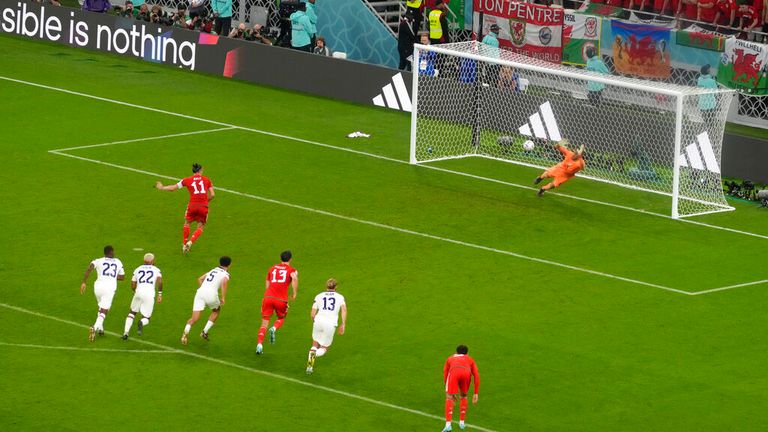 Wales' Gareth Bale scores his team's first goal against United States goalkeeper Matt Turner during the Group B soccer match between the United States and Wales at the World Cup, at Ahmad Bin Ali Stadium in Doha, Qatar, Monday, November 21, 2022. (AP Photo/Themba Hadebe)