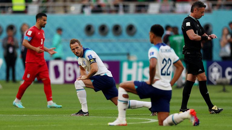  England&#39;s Harry Kane and Jude Bellingham take a knee before the match