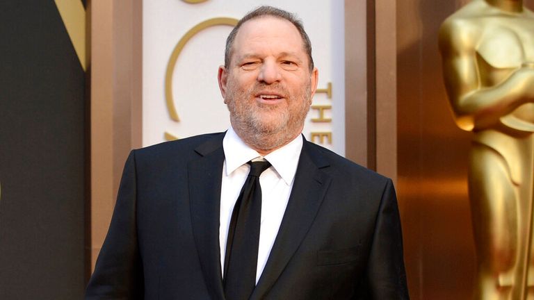 FILE - Movie mogul Harvey Weinstein arrives at the Oscars at the Dolby Theater in Los Angeles, March 2, 2014. Opening statements will begin on Monday in disgraced movie mogul Harvey Weinstein's rape and sexual assault trial in Los Angeles.  Weinstein is already serving a 23-year sentence for a conviction in New York.  (Photo by Jordan Strauss/Invision/AP, Files)