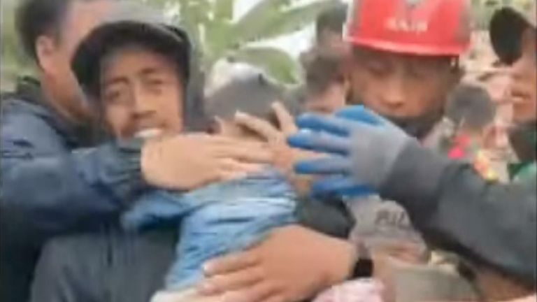 Boy rescued from rubble after earthquake in Indonesia