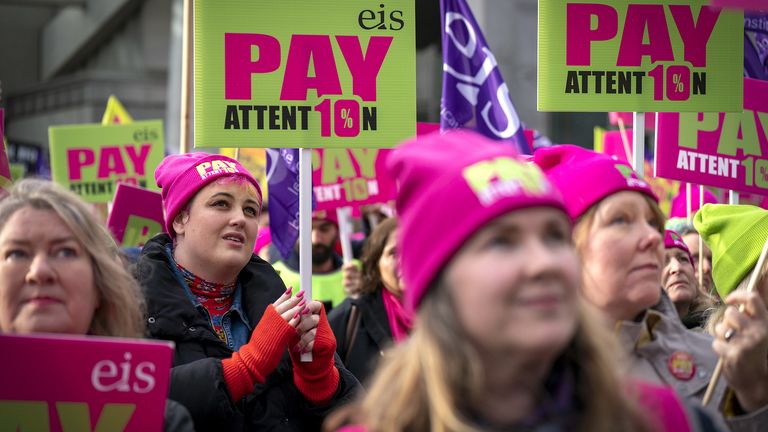 Members of the Educational Institute of Scotland (EIS) join teachers at a rally outside the Scottish Parliament in Edinburgh in a protest over pay 