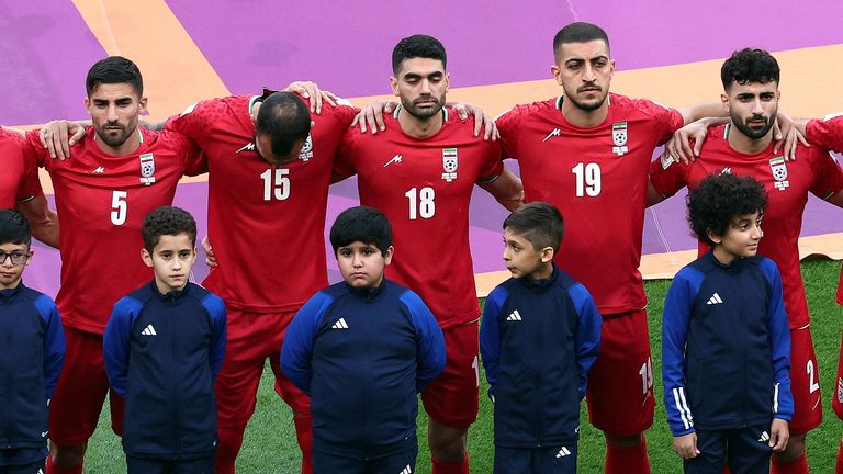 Soccer Football - FIFA World Cup Qatar 2022 - Group B - England v Iran - Khalifa International Stadium, Doha, Qatar - November 21, 2022 Iran&#39;s Ali Karimi, Milad Mohammadi and Majid Hosseini line up during the national anthems before the match REUTERS/Marko Djurica TPX IMAGES OF THE DAY