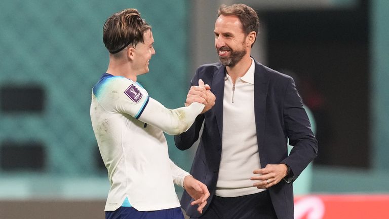 England's Jack Grealish (left) celebrates with manager Gareth Southgate after the FIFA World Cup Group B match at the Khalifa International Stadium in Doha.  Photo date: Monday 21 November 2022.