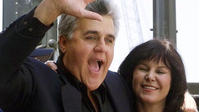 NBC late-night host Jay Leno, shown with his wife Mavis on April 27, 2000 on the Hollywood Walk of Fame in Los Angeles, is taking on a new job with rival network CBS. Leno will be producing a pilot for CBS called "Foreign Motors," a half-hour comedy set at an Internet car dealership. BK