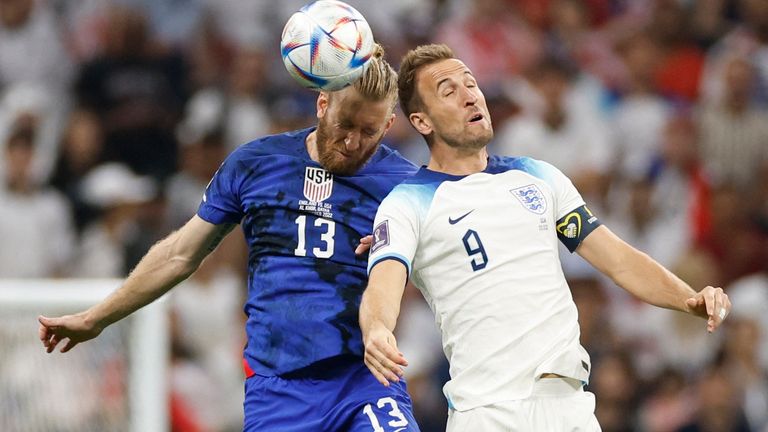 Harry Kane in action with  Tim Ream of the US