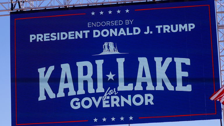 A sign of Republican candidate for Governor of Arizona Kari Lake, endorsed by former U.S. President Donald Trump, is seen before a rally ahead of the midterm elections in Mesa, Arizona, U.S., October 9, 2022. REUTERS/Brian Snyder