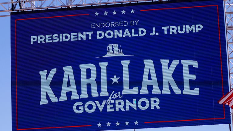 A sign by Republican candidate for Arizona Governor Kari Lake, endorsed by former US President Donald Trump, is seen ahead of a rally ahead of the midterm elections in Mesa, Arizona, United States, Oct.9, 2022. REUTERS / Brian Snyder