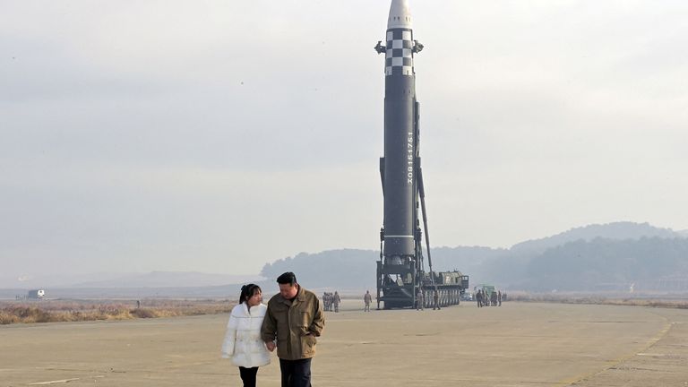 North Korean leader Kim Jong Un, along with his daughter, walks away from an intercontinental ballistic missile (ICBM) in this undated photo released on November 19, 2022 by North Korea&#39;s Korean Central News Agency (KCNA). KCNA via REUTERS ATTENTION EDITORS - THIS IMAGE WAS PROVIDED BY A THIRD PARTY. NO THIRD PARTY SALES. SOUTH KOREA OUT. NO COMMERCIAL OR EDITORIAL SALES IN SOUTH KOREA. REUTERS IS UNABLE TO INDEPENDENTLY VERIFY THIS IMAGE.
