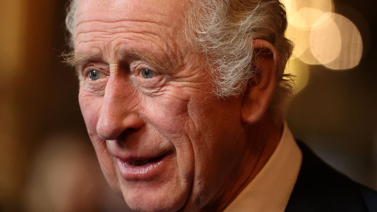 King Charles III speaks with guests during a reception and ceremony commemorating the 50th anniversary of the Resettlement of British Asians from Uganda in the UK,  