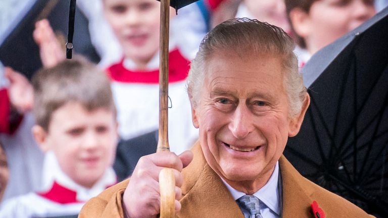 King Charles III shelters under an umbrella outside York Minster to attend a short service for the unveiling of a statue of Queen Elizabeth II, and meet people from the Cathedral and the City of York. Picture date: Wednesday November 9, 2022. Danny Lawson/Pool via REUTERS