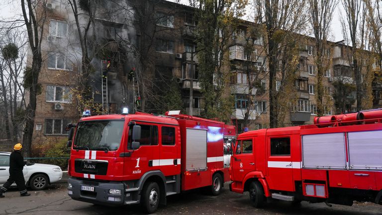 Emergency vehicles outside the building hit in Kyiv