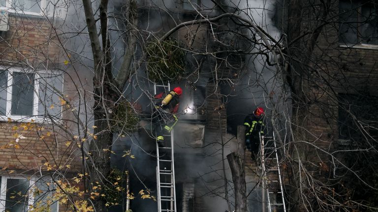 Firefighters work to put out a fire in a residential building hit by a Russian strike, amid Russia&#39;s attack on Ukraine, in Kyiv, Ukraine November 15, 2022. REUTERS/Gleb Garanich