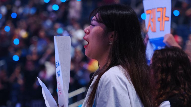 Nov 5, 2022; San Francisco, California, USA; A DRX fan with visible tears after DRX won the League of Legends World Championships against T1 at Chase Center. Mandatory Credit: Kelley L Cox-USA TODAY Sports