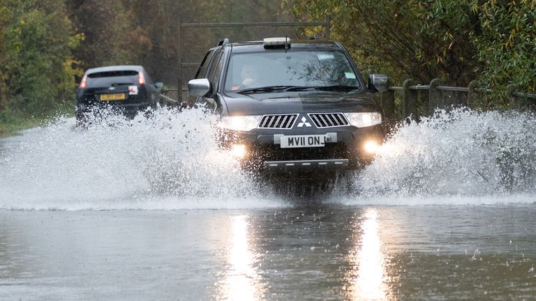 A motorist drives along a flooded road in Mountsorrel, Leicestershire. Motorists are being warned to stay off the roads as cars have become stuck in flood water caused by downpours and the UK prepares to suffer "miserable conditions" over the next two days. Picture date: Thursday November 17, 2022.