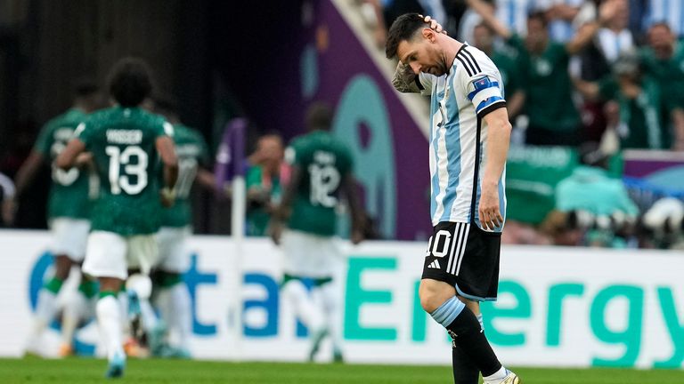 Argentina&#39;s Lionel Messi reacts as Saudi Arabia celebratie their first goal. Pic: AP