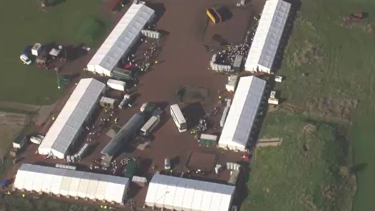 Some of the around 30 temporary marquees housing migrants in Manston, Kent are seen from the air