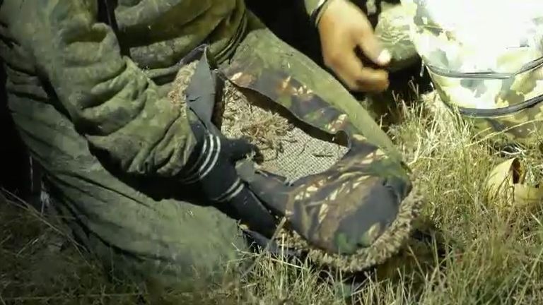 People trying to cross the border from Mexico to Arizona wear special shoes with a carpet on the soles to avoid detections.  piece by James Matthews